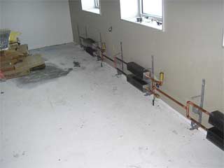fin tube heaters being installed in what then was to be the smoking lounge