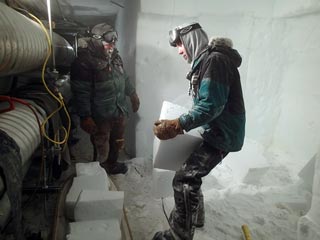 loading the ice blocks onto a sled