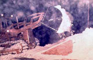 dumping snow in the snow melter