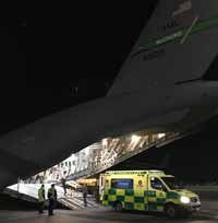 ambulance loads medical supplies onto the C-17