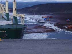 cargo ship bumping the pier