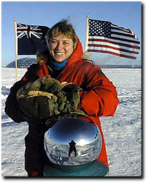 Photo of physican at the ceremonial South Pole marker.