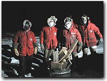 South Pole personnel prepare signal fires