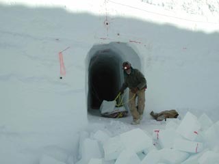 John Wright exiting a hand-dug portion of the tunnel