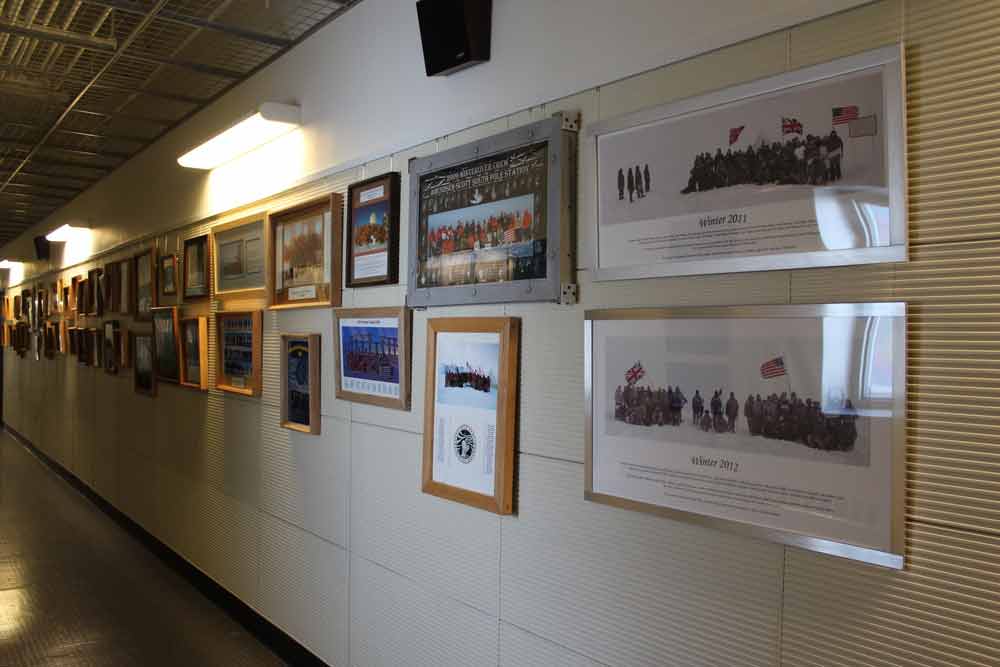 Photos of South Pole winterovers in the A3 second floor hallway
