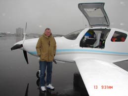 Bill Harrelson in front of his aircraft