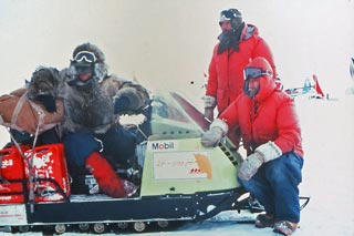 a closeup of the team at the lead snowmobile