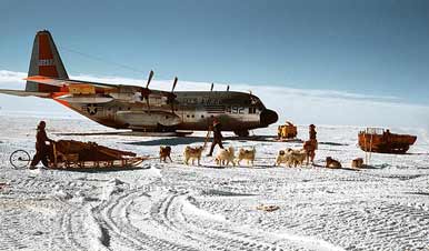 dog sleds greet a USAF C-130D at McMurdo