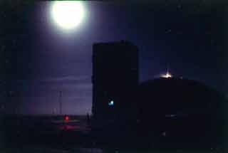 a full moon behind Skylab