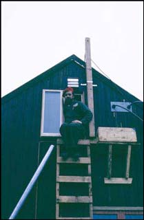 Jack Cummings emerging from the Palmer radio room aka the attic of BAS Base N