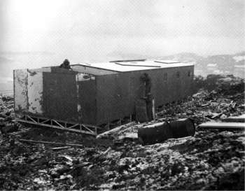 putting the roof on the first section of the structure