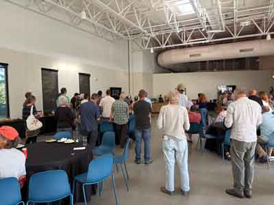 Alex speaking to the gathering